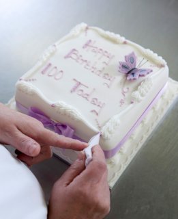 Hand written cake being hand finished